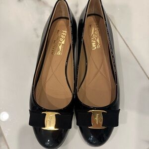 Salvatore Ferragamo Black Flats with Gold Detail, worn once. Like new condition.